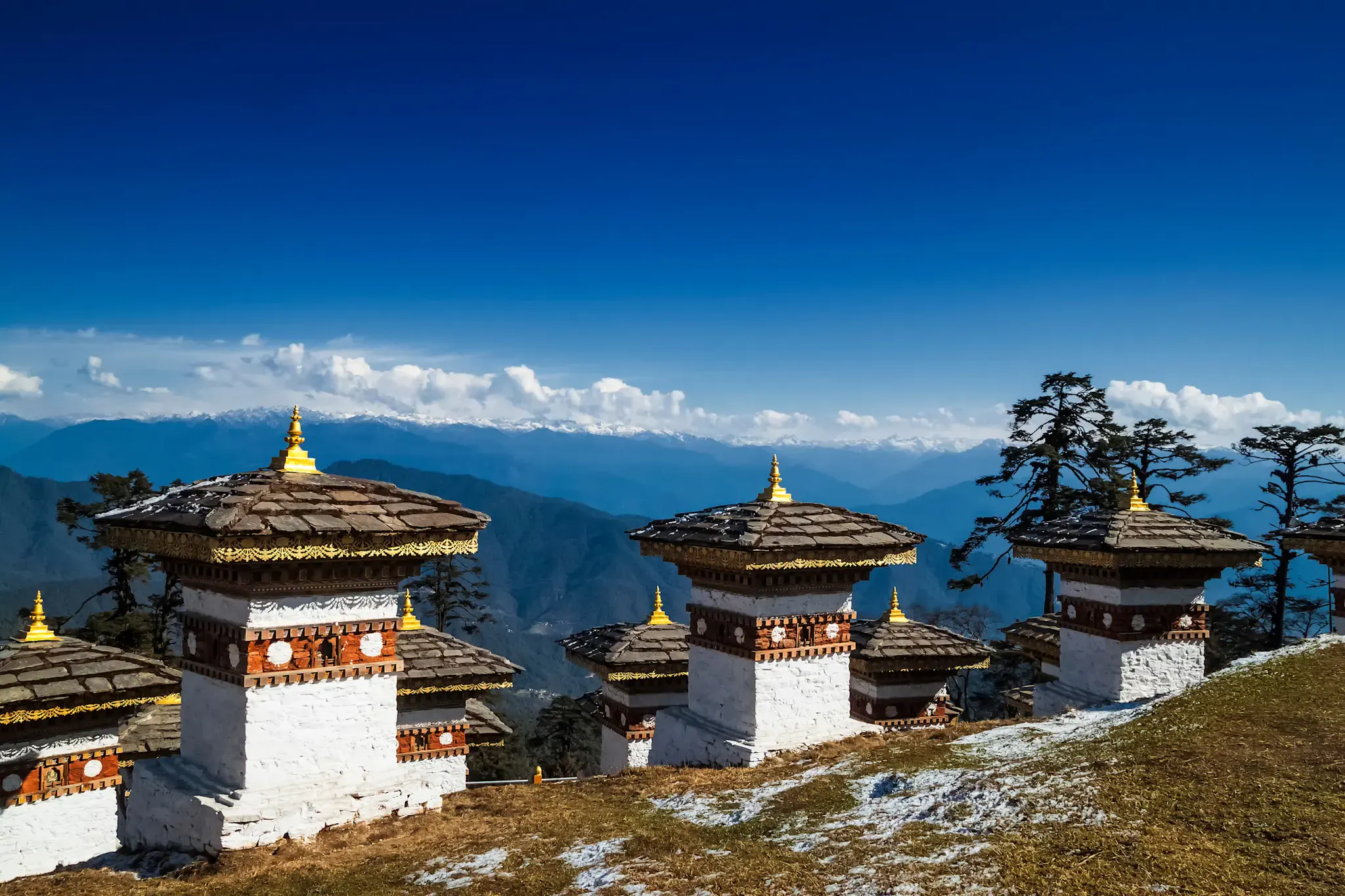 Chortens at Dochula Pass with mountains behind